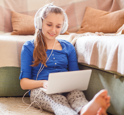 Girl listening to podcasts on headphones